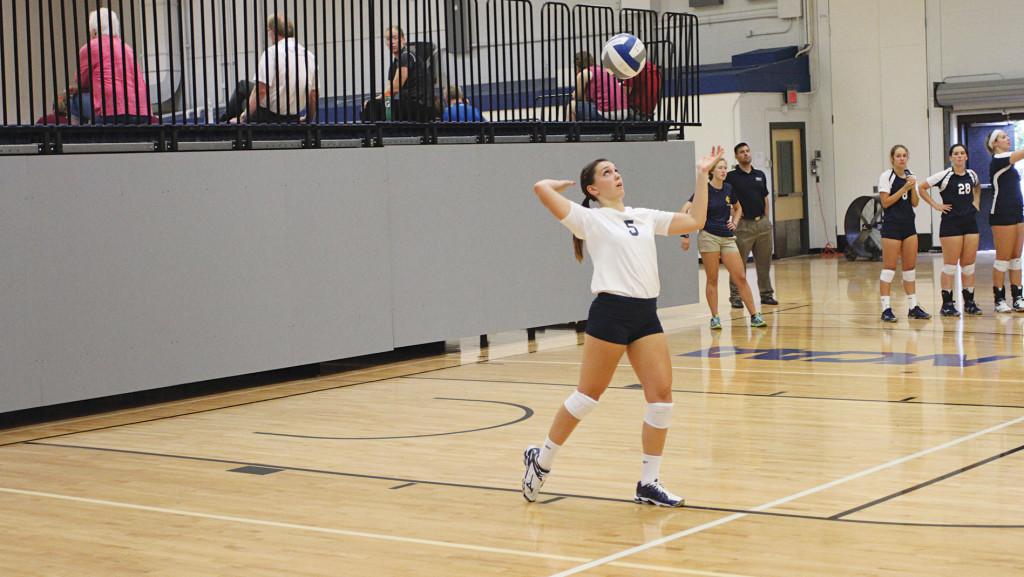 Sophomore+Kayla+Gromen+prepares+to+serve+the+ball+during+a+game+on+Sept.+5%2C+2014%2C+at+Ben+Light+Gymnasium.+