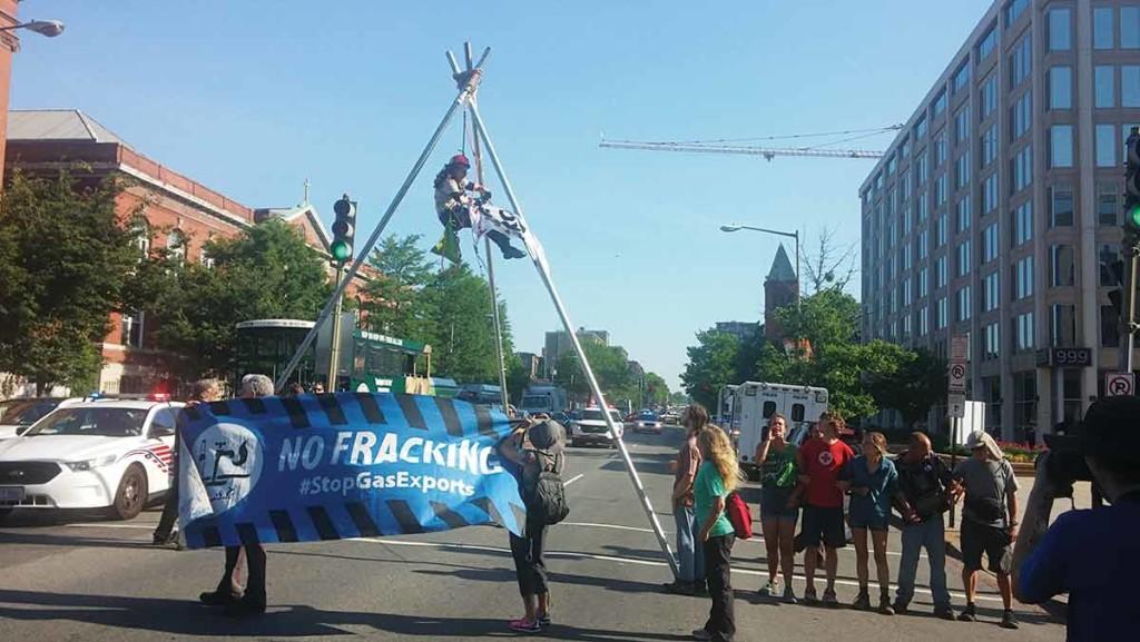 Junior Joshua Enderle (pictured on the right in the red shirt) participated in a blockade in the middle of Washington, D.C., traffic May 26 to protest the Federal Energy Regulatory Commission and the projects it funds.