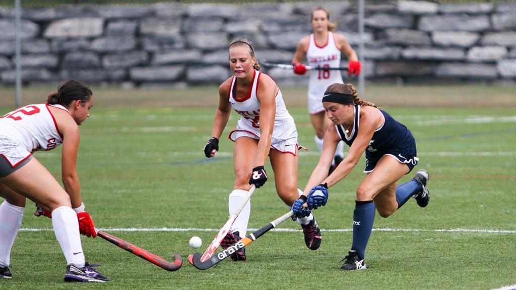 Junior Cassie Schuttrumpf goes for the ball during the field hockey teams 1–0 overtime loss to SUNY Cortland Sept. 9 at Higgins Stadium.