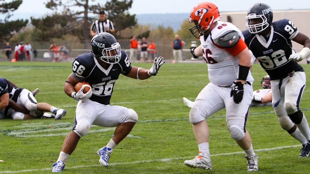 Sophomore linebacker Kenny Bradley attempts to get past a defender after his 19-yard interception return in the football teams 24–6 win over Hobart College at Butterfield Stadium.