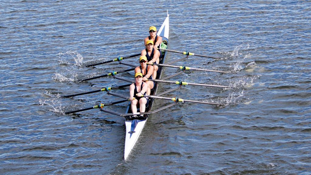 Members of the sculling team row during its first regatta of the season Sept. 26 at Cayuga Inlet. The Bombers won two out of the three events.