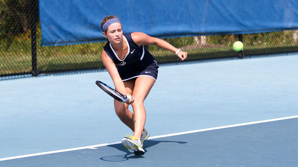 Junior+Haley+Kusak+prepares+to+hit+the+ball+in+a+matchup+against+Utica+College+on+Sept.+5%2C+at+the+Wheeler+Tennis+Courts.