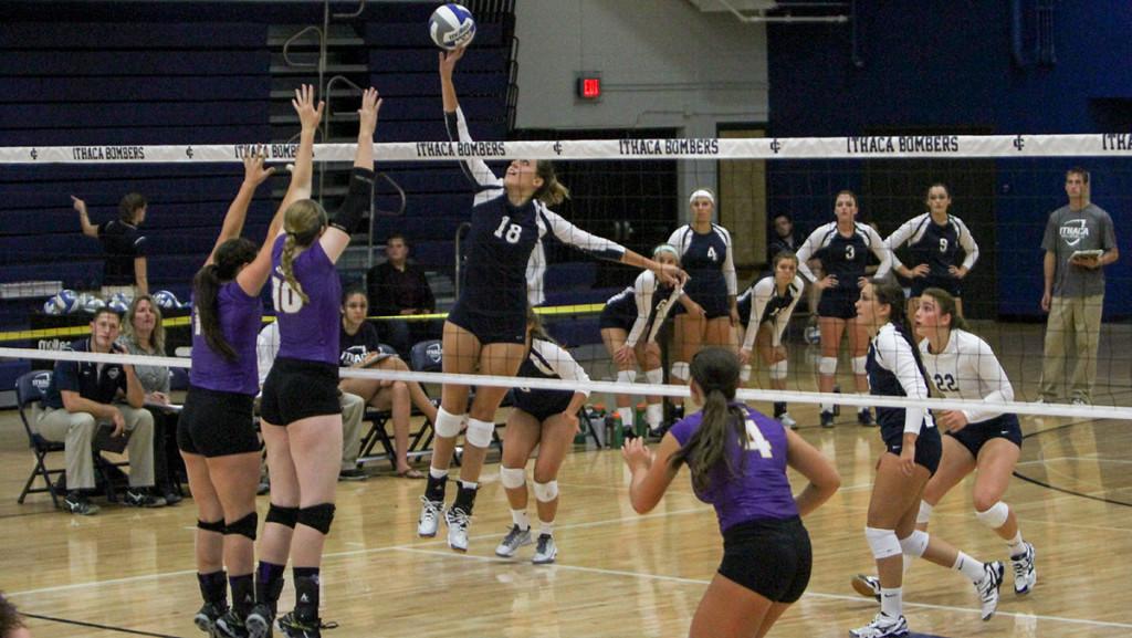 Freshman+Katie+Evans+spikes+the+ball+over+the+net+during+the+volleyball+teams+game+on+Sept.+11+in+Ben+Light+Gymnasium.