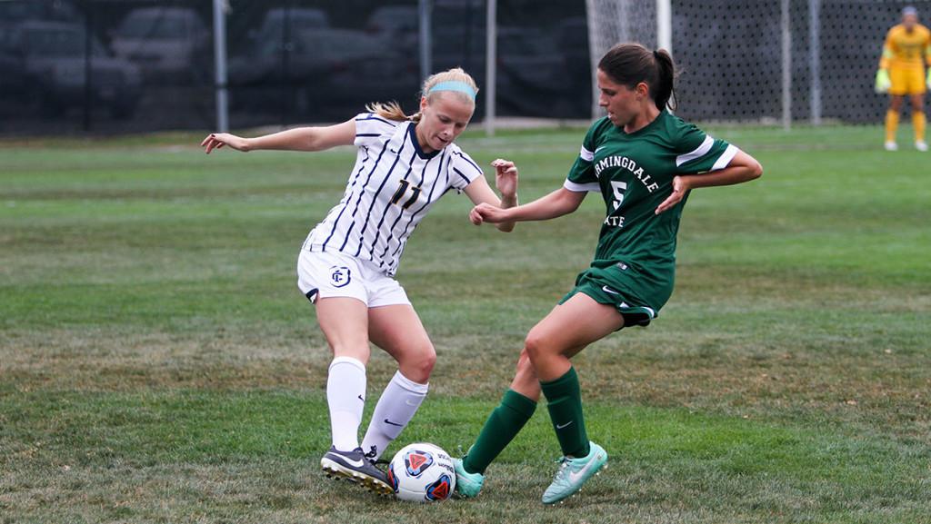 Freshman defender Megan Amaral plays one-on-one against a Farmingdale State College opponent on Sept. 12 at Carp Wood Field. The Bombers won the game by a final score of 2–0 against the Rams. 