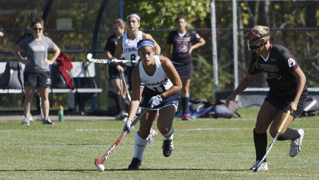 Senior midfielder and captain Olivia Salindong moves the ball past a Stevens Institute of Techonology defender in the field hockey teams match against the Ducks on Oct. 11 at Higgins Stadium.