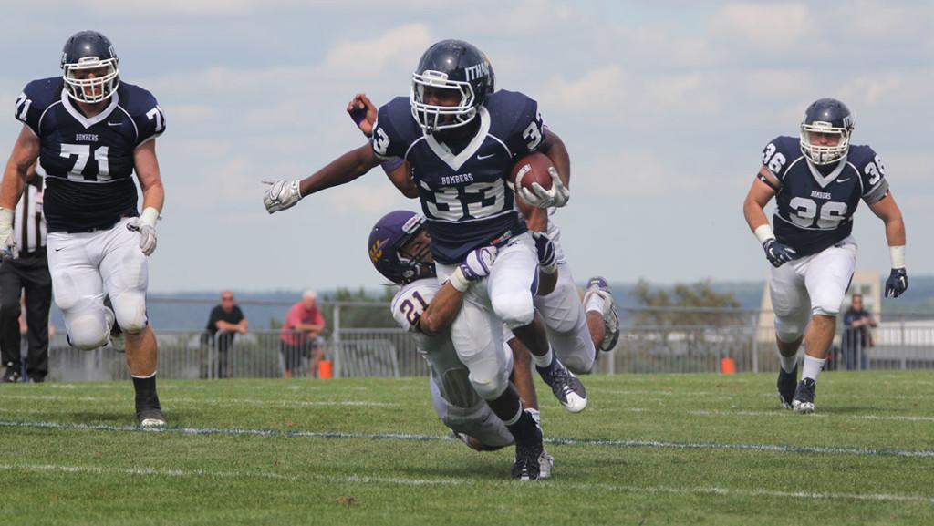 Sophomore running back Tristan Brown attempts to run past an Alfred University defender during the football teams 38–18 win over Alfred on Sept. 23 at Butterfield Stadium. 