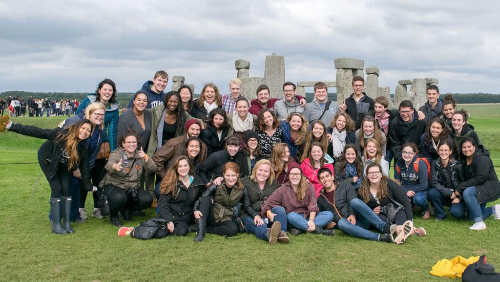 A group of Ithaca College students studying in London, posed for a photo at the Stonehenge in Wilshire, England.  