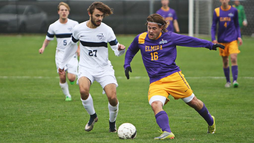 An Elmira midfielder attempts to kick the ball past freshman midfielder Nathan Schoen in the mens soccer game on Oct. 24 at Carp Wood Field. The Bombers defeated the Soaring Eagles 2–1 in overtime.