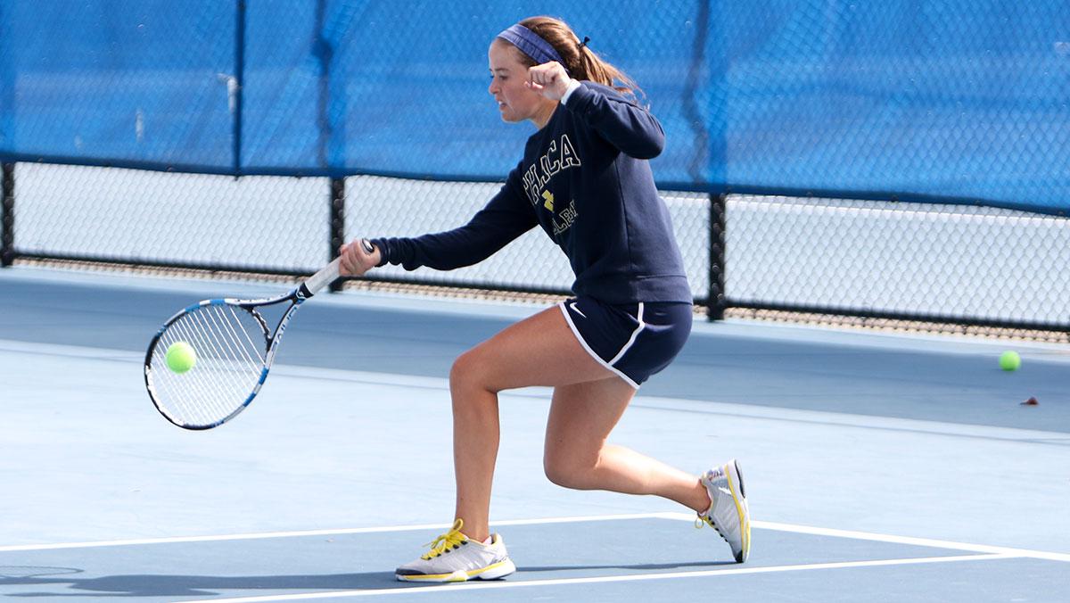 Women’s tennis player making a racket in first year on team