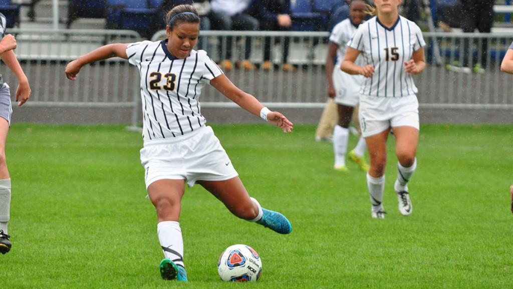 Sophomore midfielder Kristyn Alonzo kicks the ball in the womens soccer match against Houghton College on Oct. 3, when the Blue and Gold earned a 1–0 double-overtime win. The Bombers went on to defeat Hartwick College 1–0 on Oct. 6.