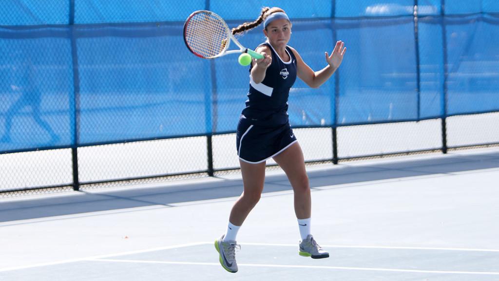 Freshman Caroline Dunn goes to hit the ball in the womens tennis teams match against Hartwick College on Oct. 4 at the Wheeler Tennis Courts. The Bombers now own a 9–0 overall record on the season.