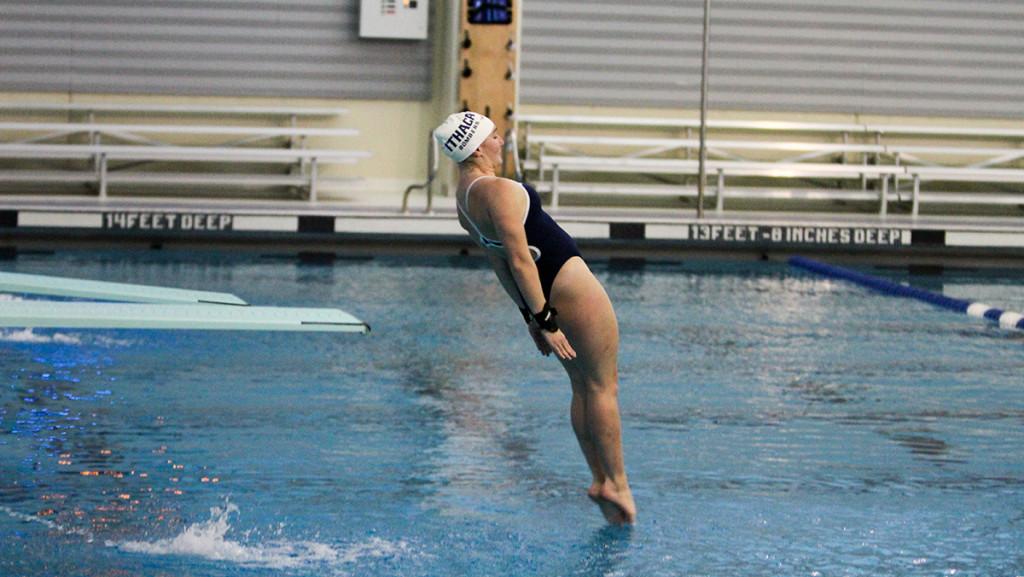 Sophomore Anna Belson dives off the 1-meter board during the swimming and diving meet Nov. 7 at Athletics and Events Center. Belson set two pool records in the 1-meter and 3-meter diving events at Bristol Pool.