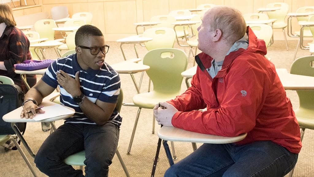 From left, sophomore Elijah Greene and junior Tim Conners work on their debate skills together at the speech and debate team meeting Nov. 10. The team recently took first place for debate at a Boston competition.