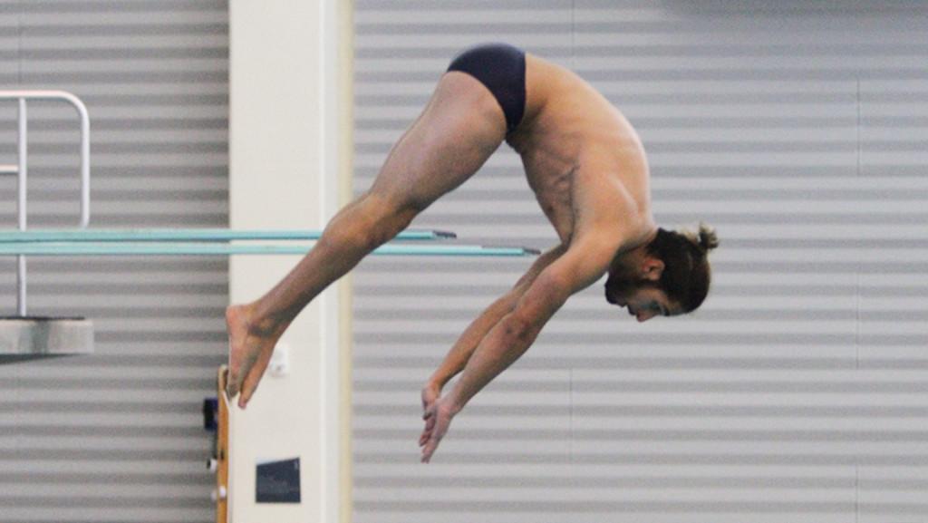 Senior Jon Yoskin competes in the 3-meter dive during the swimming and diving meet against SUNY Cortland on Nov. 7. Yoskin came in fourth in the event. 