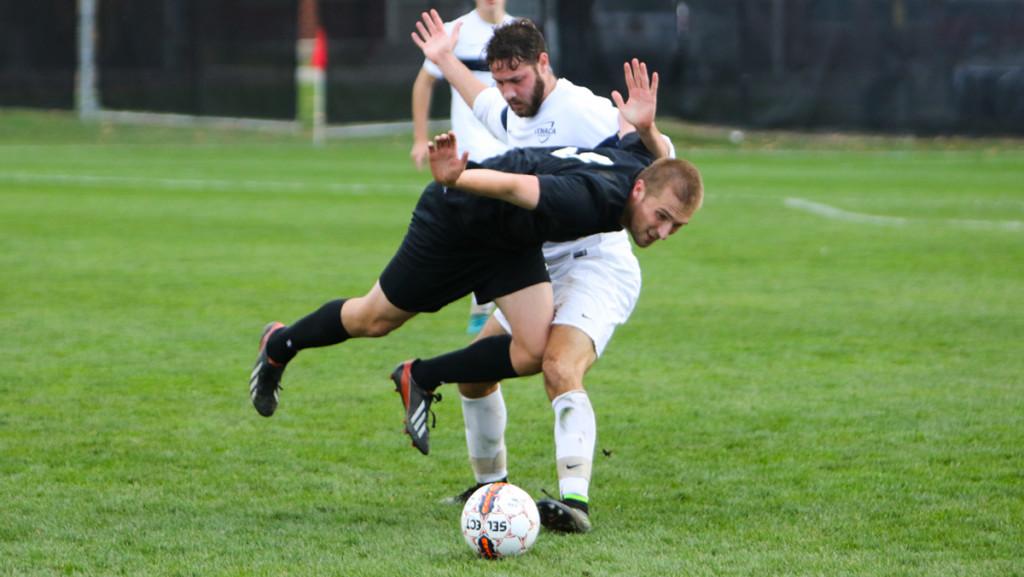 Senior forward Jordan Filipowich fights with a Stevens defender to gain possession of the ball. The Bombers lost 1–0 in the Empire 8 Championship final.