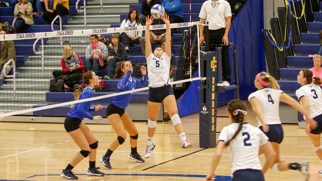 Sophomore captain Kayla Gromen sets a spike during the volleyball match Oct. 24 at Ben Light Gymnasium.