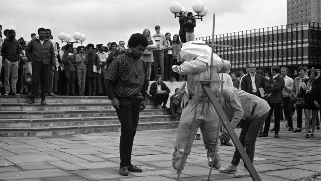A student begins to light a scarecrow meant to represent the administration during a protest in 1969. 
