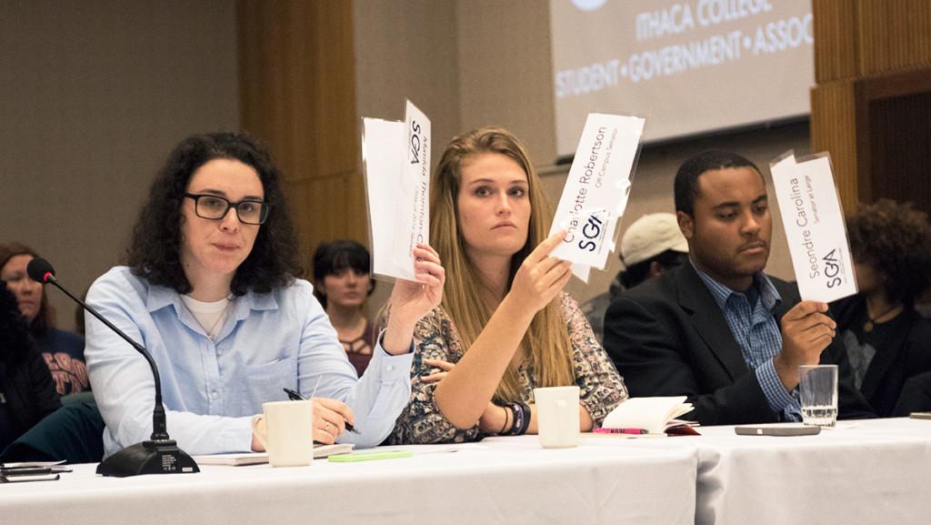 From left, senators Matilda Thornton-Clark, Charlotte Robertson and Seondre Carolina vote at a Student Government Association meeting. It was announced Jan. 19 that Thornton-Clark would fill the open position for vice president of campus affairs.