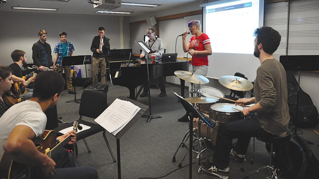 Students in the music class, “IC Wedding Band” rehearse for their upcoming holiday show on Dec. 12. As part of their final project, students had to perform at an actual wedding. 