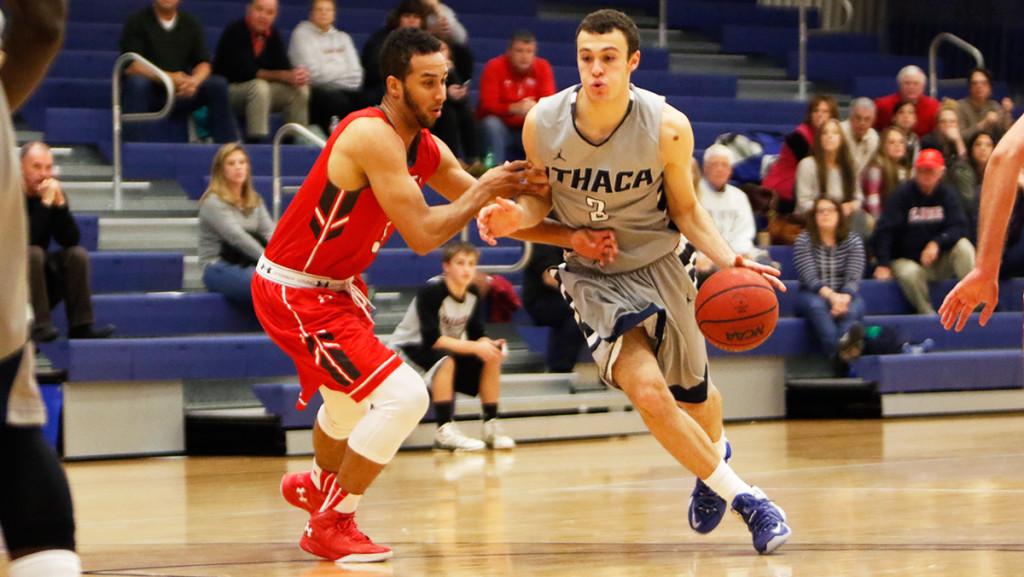 Sophomore guard Marc Chasin dribbles away from a St. Lawrence defender during the men's basketball team's game against St. Lawrence on Dec. 5 at Ben Light Gymnasium. Chasin scored 12 points for the Bombers. 