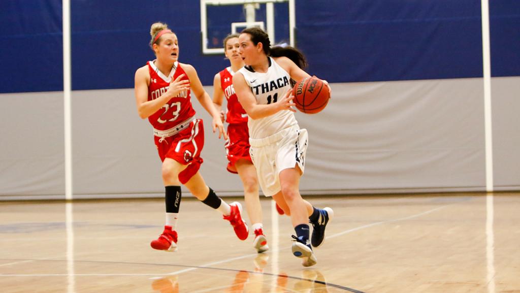Sophomore guard Allison Spaschak passes the ball to a teammate during the womens basketball game Dec. 1 against SUNY Cortland at Ben Light Gymnasium. Spaschak scored a career-high 9 points for the Bombers in their 62–48 win.