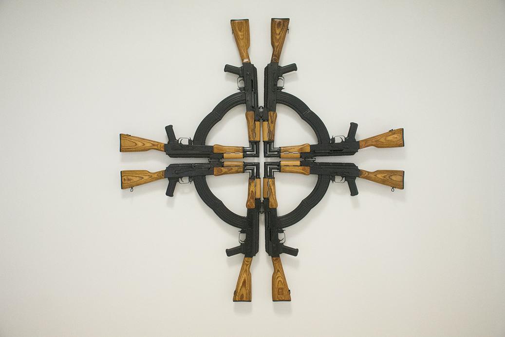 Mel Chin’s piece, “Cross for the Unforgiven: 10th Anniversary,” is one of many pieces featured in “UNLOADED,” which features work from over 20 different artists that explores the historical and social contexts of guns. Sam Fuller/The Ithacan