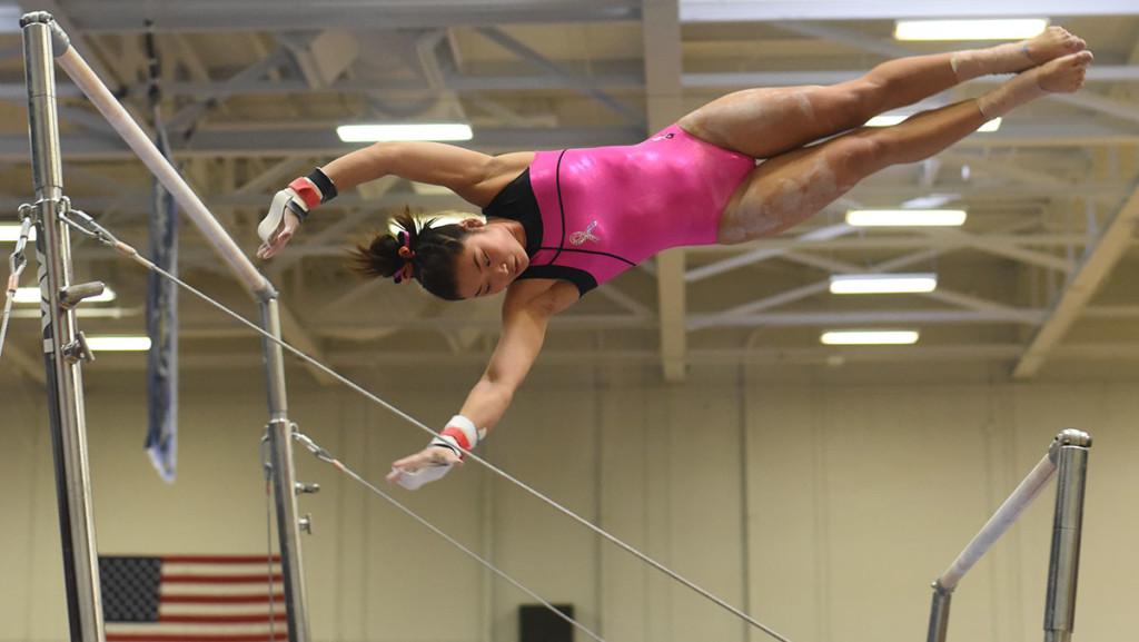 Senior Megan Harrington competes on the uneven bars Feb. 28 at the Harriet Marranca Memorial Invitational. She placed 12th on the event with a score of 9.275. 