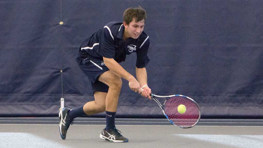 Senior Chris Hayes hits the ball during his match Feb. 14. He won both his singles and doubles matches.