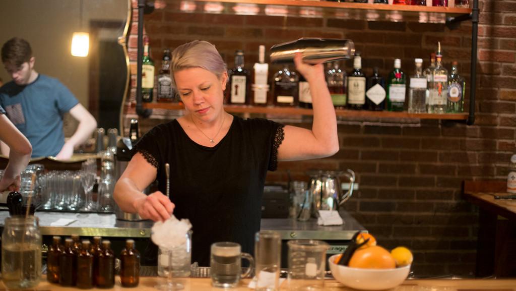 Melody Faraday, bartender of The Rook, mixes a cocktail, one of many on the restaurants extensive drink menu.