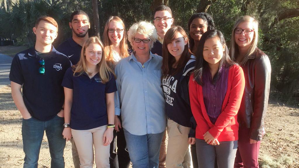 The nine Ithaca College students selected to work with NBC to cover the South Carolina Republican primary stand with Ann Marie Adams 98, lecturer in the Department of Strategic Communications, who hosted the students during their time in South Carolina. 