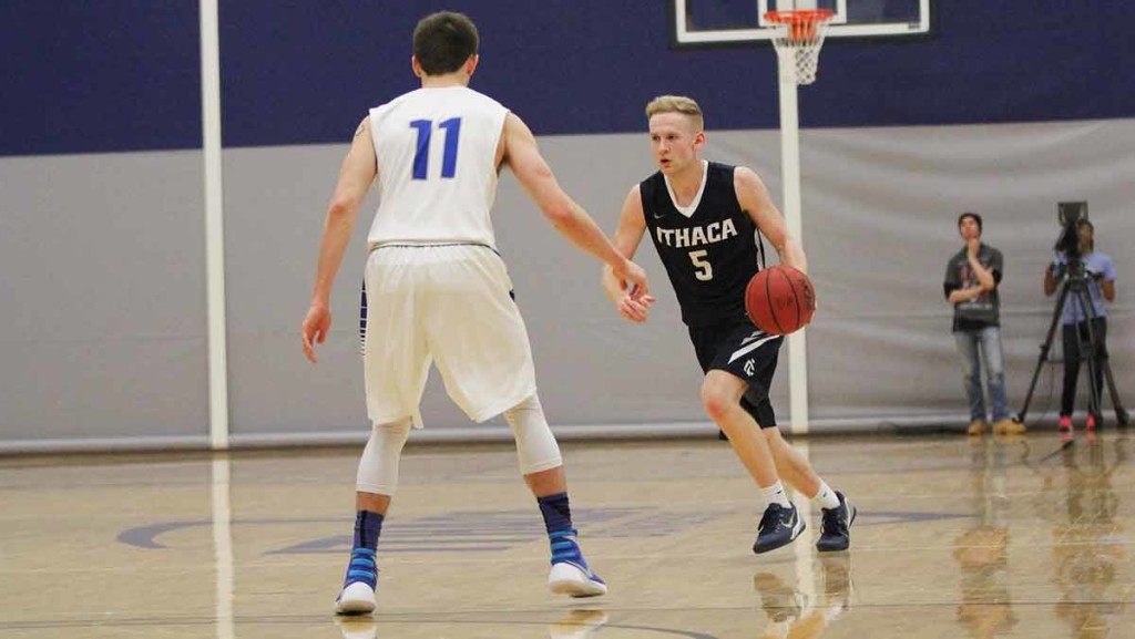 Senior guard Sam Bevan attempts to drive past a defender Feb. 20 against Hartwick College in Ben Light Gymnasium.