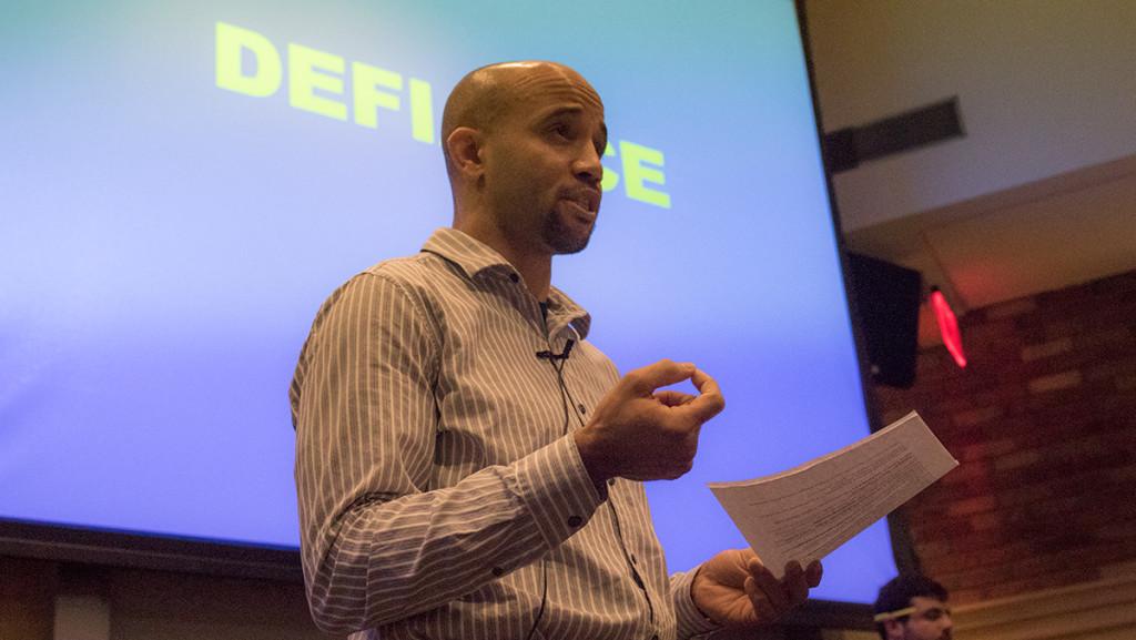 Derek Adams, assistant professor in the Department of English, talks to the audience at the Nov. 11, 2015 teach-in in Textor. Adams was one of three faculty members that POC at IC demanded receive immediate tenure. 