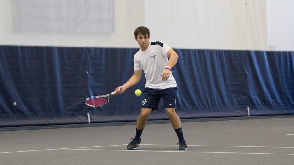 Senior Chris Hayes plays in one of his tennis matches last season in Glazer Arena. This year, he is the only senior on the mens tennis team. 