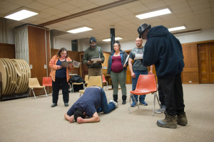 Members of the ReEntry Theatre Program practice a short skit in the play focusing on addiction. Sam Fuller/The Ithacan