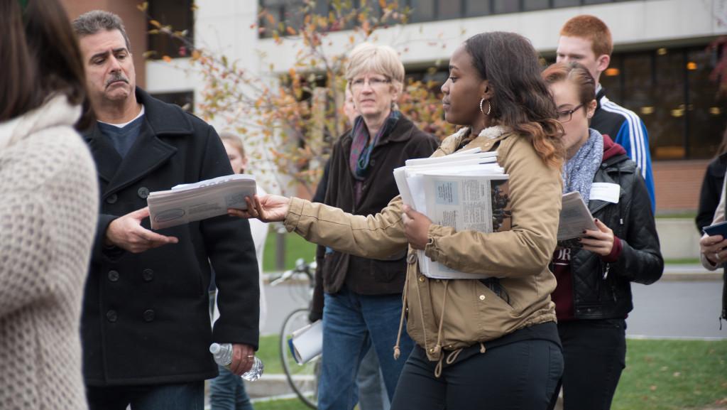 Students hand out copies of The Ithacan to prospective students and families during the fall 2015 protests at Ithaca College. Many students have mixed feelings about diversity on campus after transitioning to college from more diverse locations.