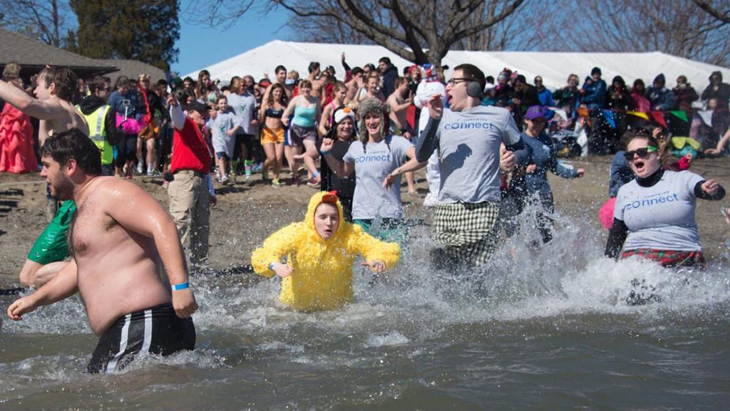 Members+of+the+Ithaca+community+plunge+into+the+Cayuga+lake+March+19+at+Taughannock+Falls+State+Park.