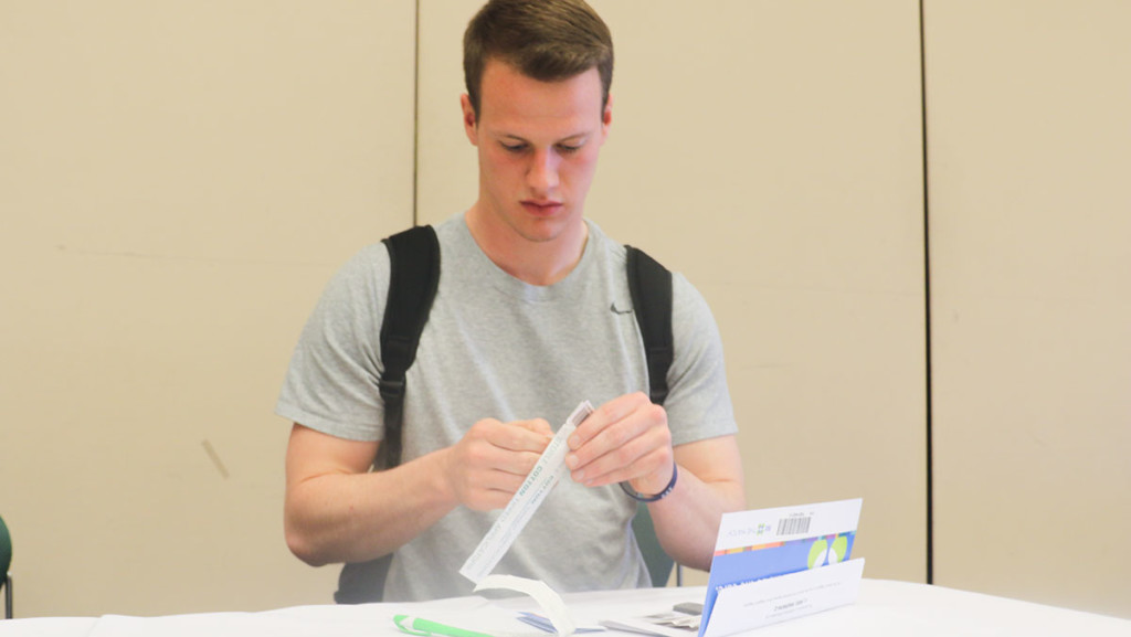 Sophomore Seth Abbot prepares to take his bone marrow test in Emerson Suites in the Campus Center on March 31. 