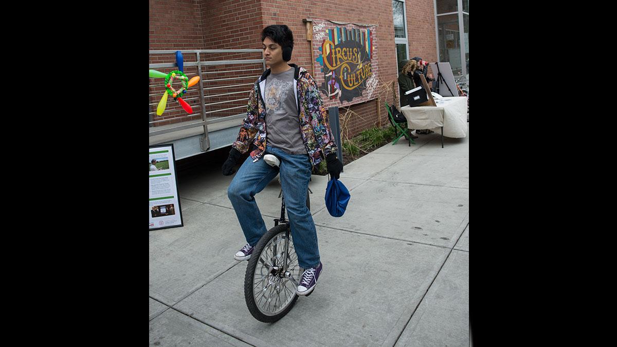 PJ Arroyo, a community member at Ithaca’s Circus Culture, rides a unicycle during the event.