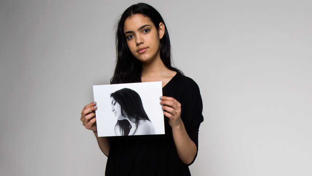 Ithaca College senior Gabby Jorio holds an old photo of herself to represent her journey facing adversity in the fashion industry. Jorio wants to use her passions for art history and fashion to revolutionize the fashion industry and society’s definition of beauty.
