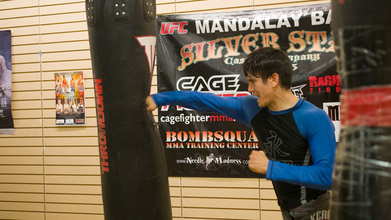 Student and professor participate in Mixed Martial Arts
