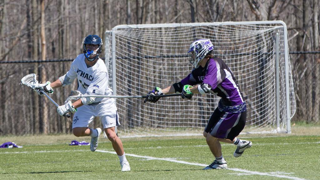 Freshman Brendon Lao avoids a Houghton College defender April 16 in Higgins Stadium. The Bombers are now  12–1 at home.