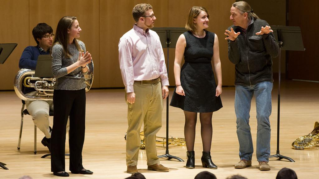 From left, seniors Kaitlyn DeHority, Benjamin Allen and Victoria Boellmembers — members of music group add 5 — and Mnozil Brass member Leonhard Paul receive feedback from Paul during a master class April 4.