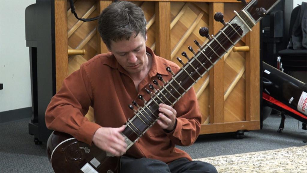 Ethnomusicologist Stefan Fiol plays scales from the South Asian piece Raga Bhairav on the sitar during a Master Class on Sitar.
