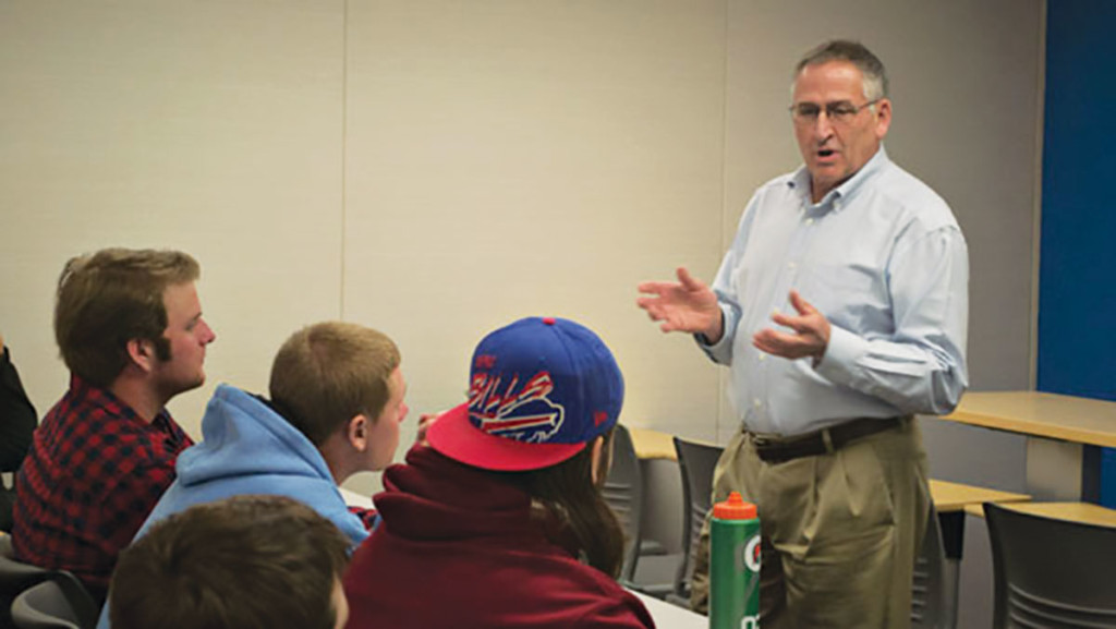 Stephen Mosher, coordinator of the Sport Studies minor program, teaches his Social Aspects of Sport class in 2014.