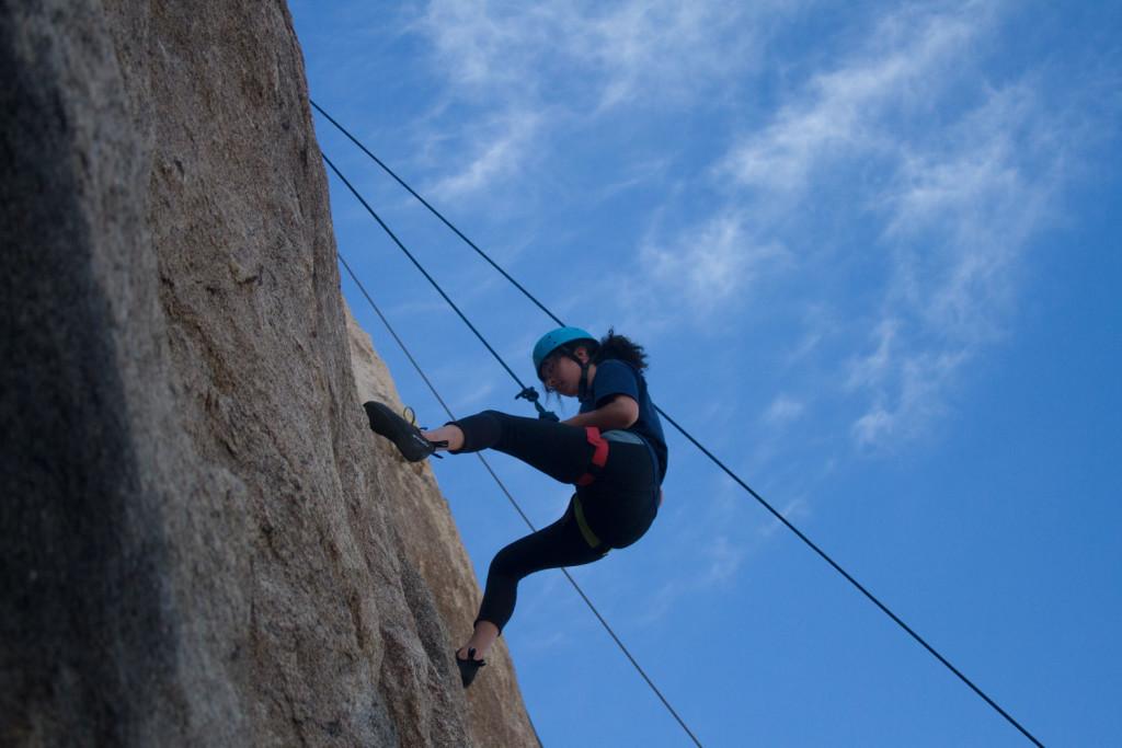Sarah Stuart-Sikowitz lowers down from a route she climbed on Hodge Podge Rock near the group's campsite in Indian Cove Campground, one of Joshua Tree National Park's nine official campgrounds. FAITH MECKLEY/THE ITHACAN
