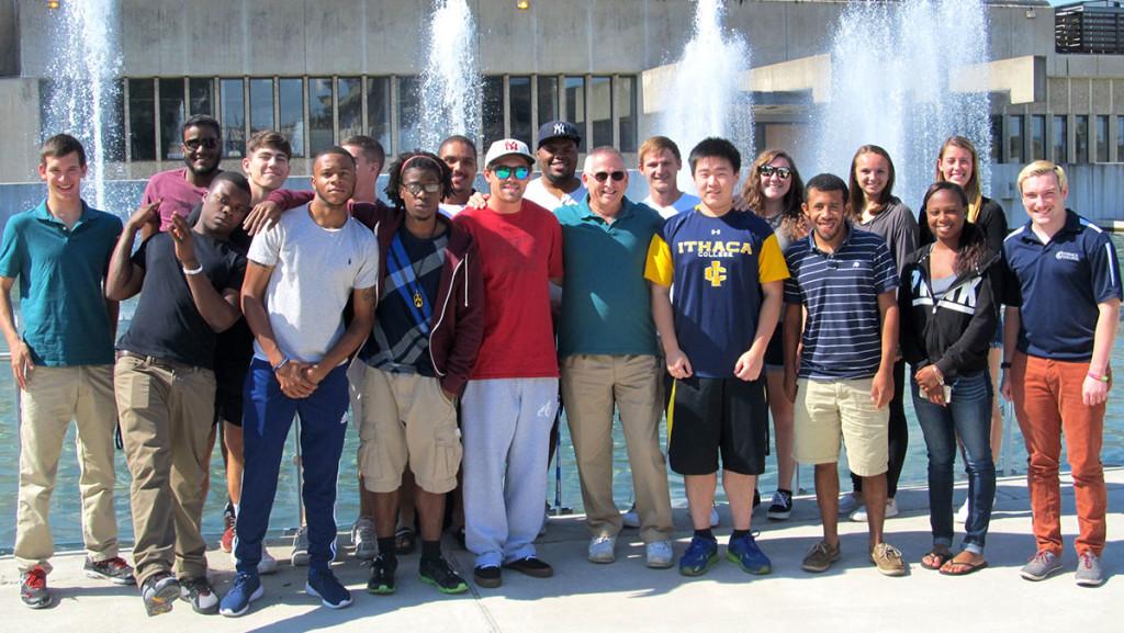 The last students to complete the sport studies major, members of the classes of 2016–18, pose in front of the Dillingham Fountains in Fall 2015. The sport studies major is now only offered as a minor, and additionally Ithaca College faculty and administrators announced a proposal to split up the Department of Sport Management and Media April 29 during a town hall meeting.