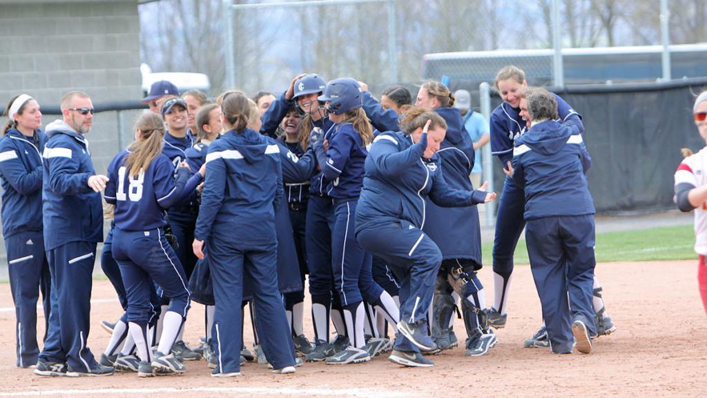 The softball team celebrates after defeating St. John Fisher College to win the Empire 8 Championship on May 8. 