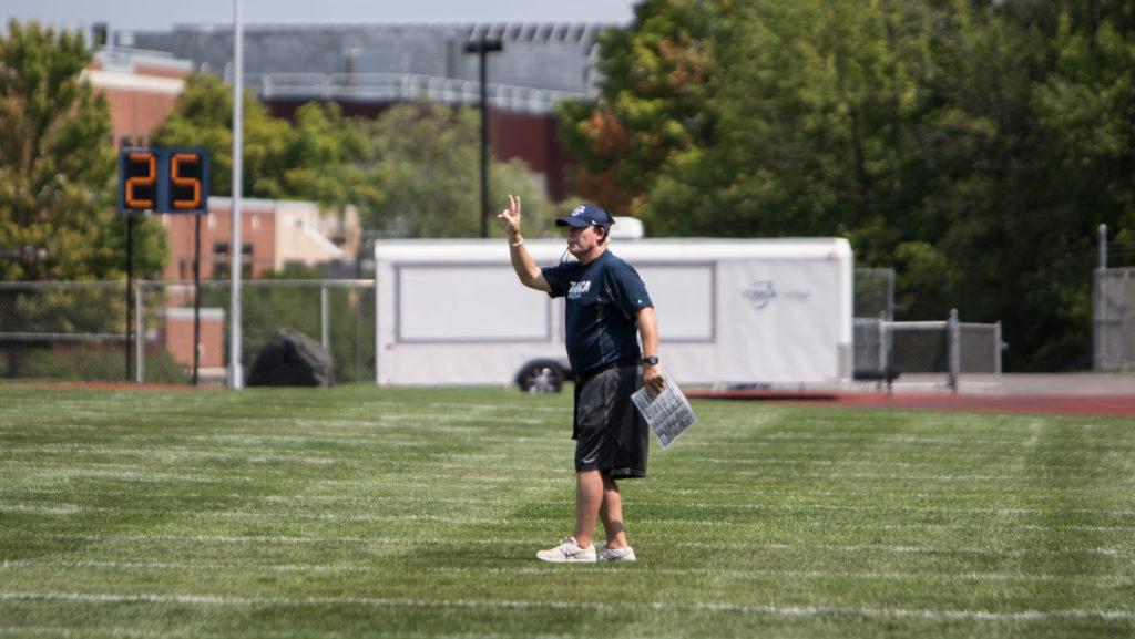 Head football coach Mike Welch yells directions from the sideline during the teams scrimmage Aug. 20 in Butterfield Stadium. Welch has been head coach for the past 22 seasons. 