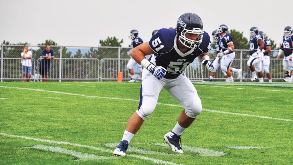 Sophomore Marc Barbieri prepares for a play on the defensive line against Hobart College on Sept. 19, 2015.
