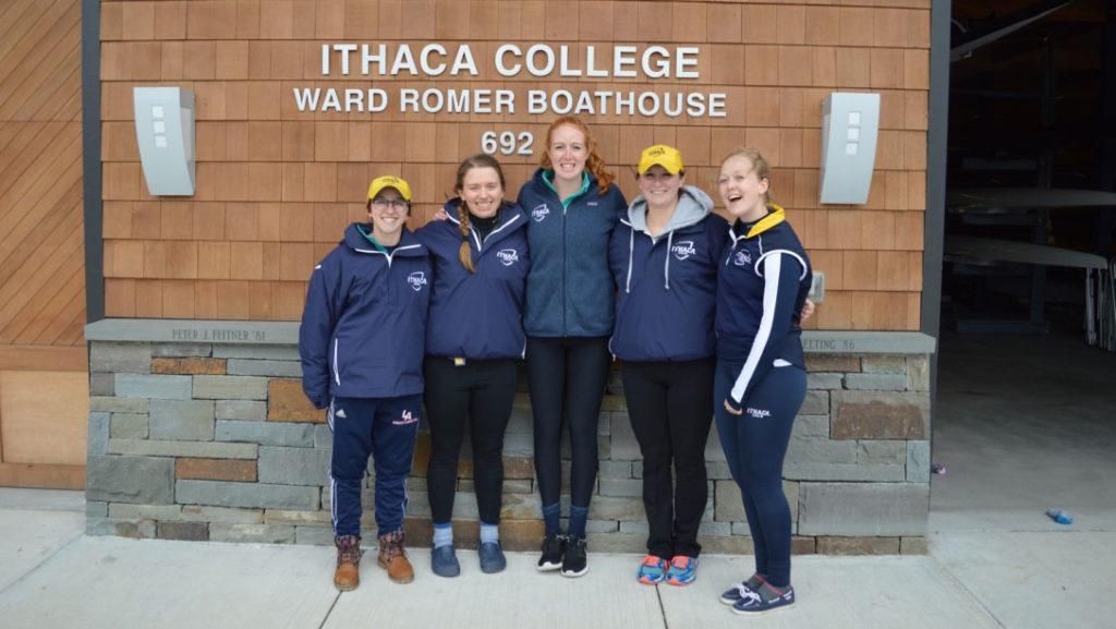 From left, junior Julia Williamson, senior Rebecca Veninsky, Emily Morley 16, junior Bailey Doran and senior Maeve Berry pose in front of the Ithaca College Ward Romer Boathouse. The seven-minute version of the documentary premiered at the Women in Media Day Challenge on March 8 in Roy H. Park Hall and the four plan to expand the documentary in the future. 